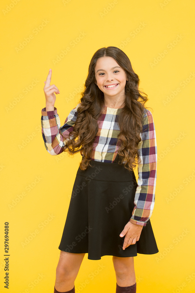 My idea. Little child pointing finger up yellow background. Adorable schoolgirl got idea. Expressing smart idea. Lets consider the idea. School time. Education My idea. Little child pointing finger up yellow background. Adorable schoolgirl got idea. Expressing smart idea. Lets consider the idea. School time. Education
