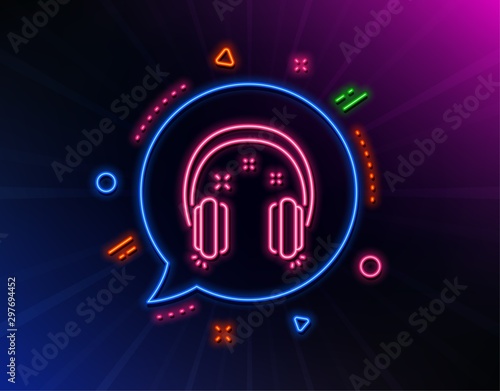 Headphones line icon. Neon laser lights. Music listen sign. Musical earphones symbol. Glow laser speech bubble. Neon lights chat bubble. Banner badge with headphones icon. Vector