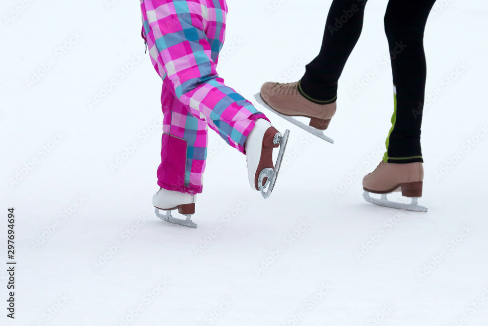 children skate on the ice rink. Sport and entertainment. Rest and winter holidays. children skate on the ice rink. Sport and entertainment. Rest and winter holidays.