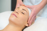 woman having forehead massage
