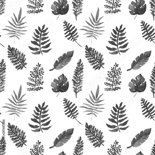 Seamless pattern with watercolor leaves of tropical plants.