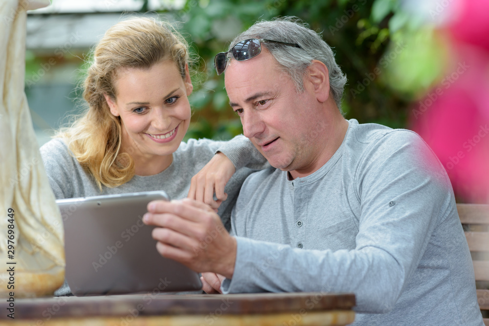 business man with tablet woman laughing business man with tablet woman laughing
