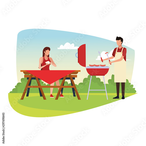 woman and man in a picnic and bbq