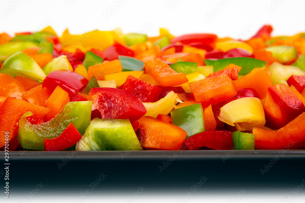 Sliced colored bell peppers on a plate. Vitamin healthy food. Sliced colored bell peppers on a plate. Vitamin healthy food.