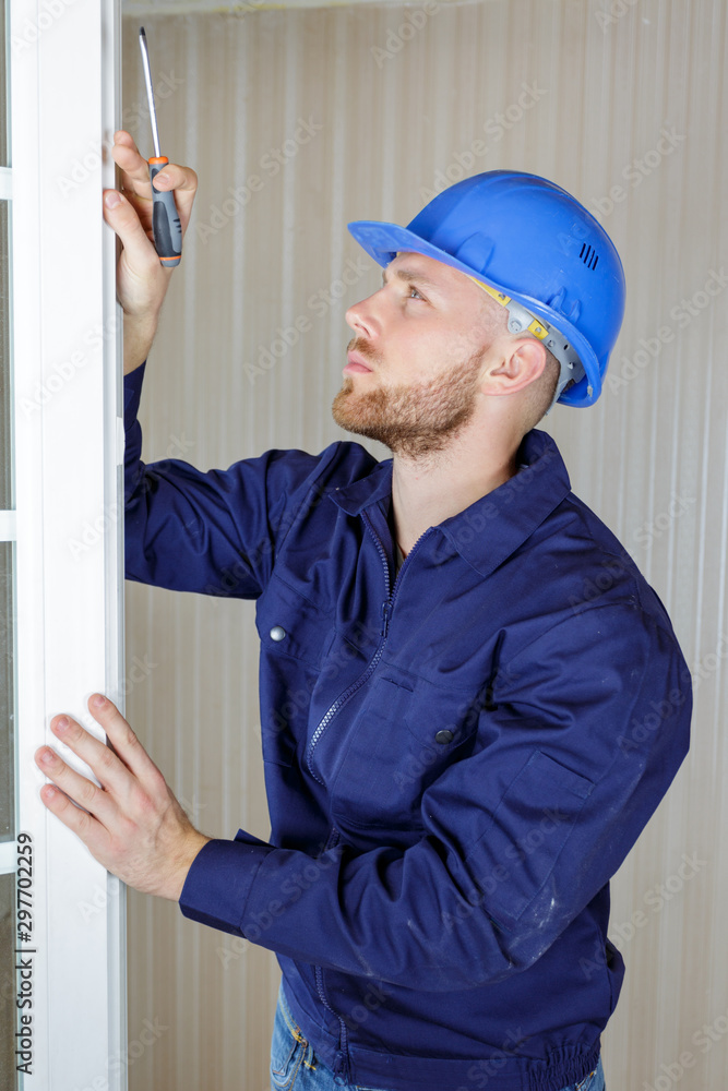 vertical view of window fitter at work vertical view of window fitter at work