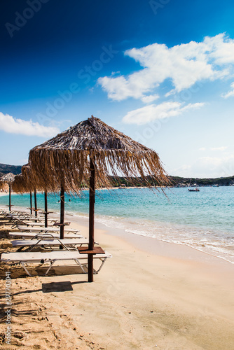 beach with chairs and umbrellas