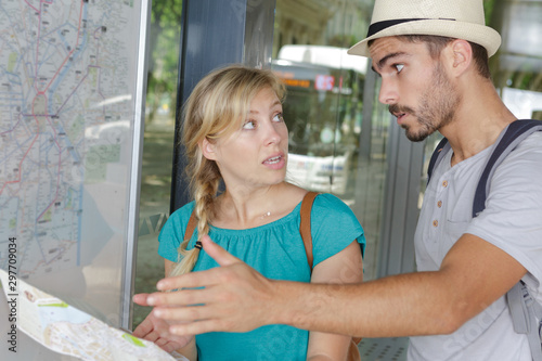 angry couple of tourists discussing about the map