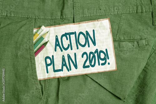 Text sign showing Action Plan 2019. Business photo text proposed strategy or course of actions for current year Writing equipment and white note paper inside pocket of man work trousers