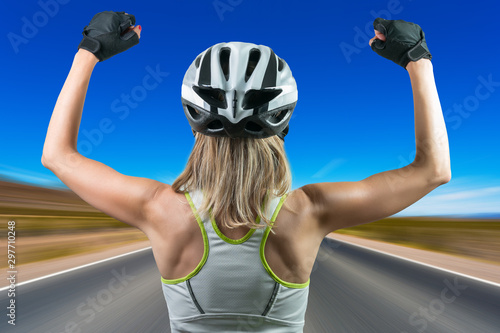 Excited cyclist enjoying the win. Concept Winning in sports. photo