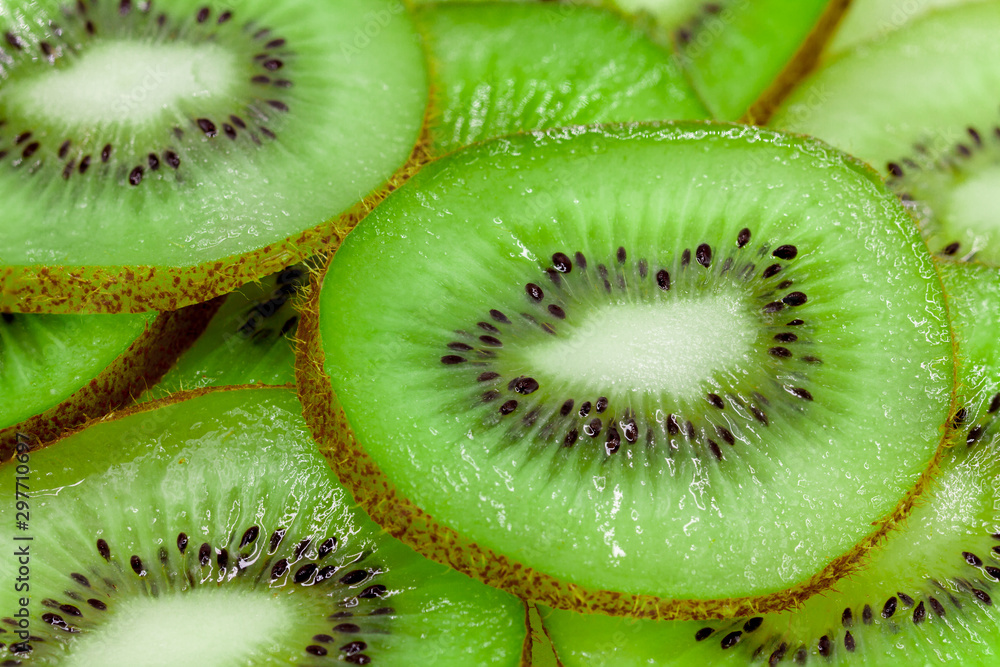 Slices of kiwi fruit on kiwi background. Slices of kiwi fruit on kiwi background.