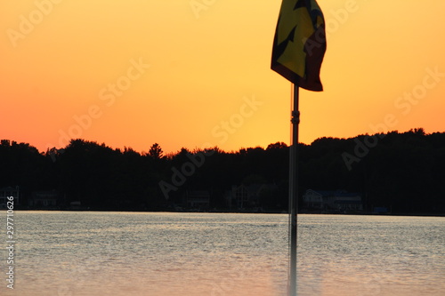 sunset lake with flags