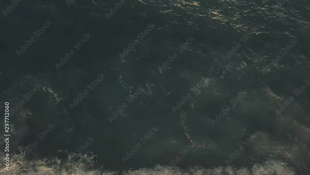 Beautiful beach on the sea coast with turquoise water and sand on a sunny day at sunset. Aerial view. Natural background. Exotic landscape. Tourist trip to hot countries Beautiful beach on the sea coast with turquoise water and sand on a sunny day at sunset. Aerial view. Natural background. Exotic landscape. Tourist trip to hot countries