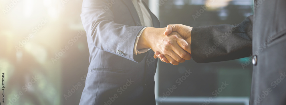 successful negotiate and handshake concept, two businessman shake hand with partner to celebration partnership and teamwork, business deal