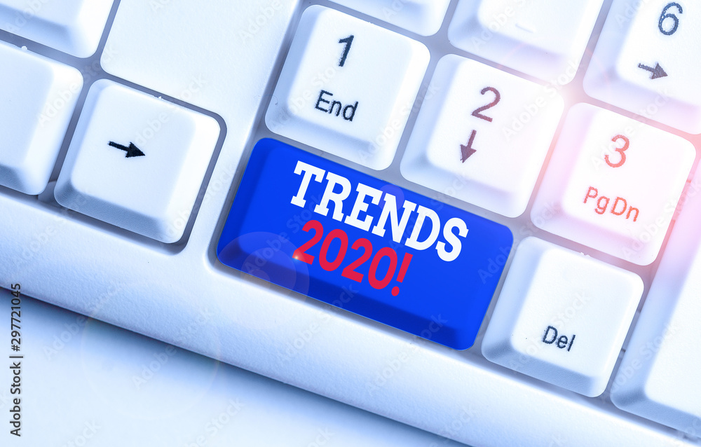 Text sign showing Trends 2020. Business photo text general direction in which something is developing or changing White pc keyboard with empty note paper above white background key copy space Text sign showing Trends 2020. Business photo text general direction in which something is developing or changing White pc keyboard with empty note paper above white background key copy space