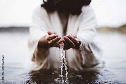 Fototapete Biblical scene - of Jesus Christ drinking water with his hands