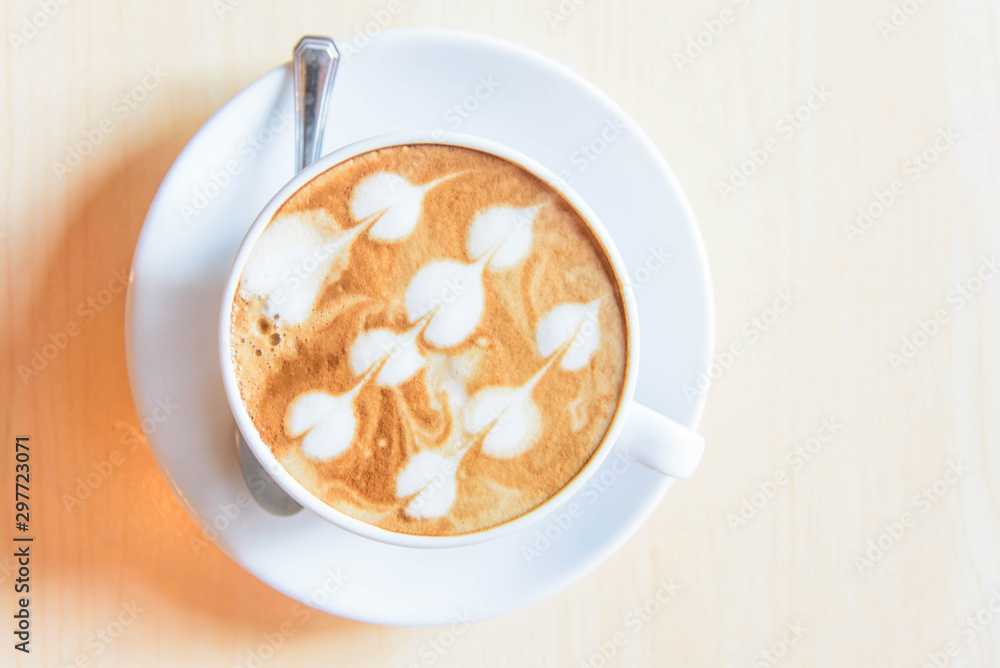 hot coffee on table / hot cappuccino with nice pattern milk foam hot coffee on table / hot cappuccino with nice pattern milk foam