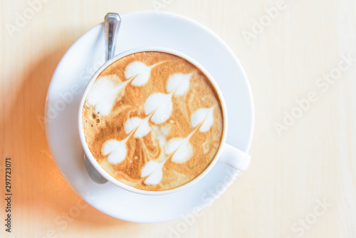hot coffee on table / hot cappuccino with nice pattern milk foam 