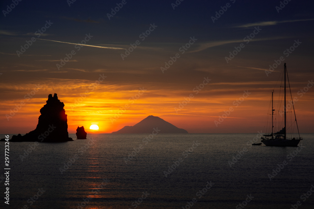 Sunset over the Mediterranean sea with the shadow of Filicudi volcano