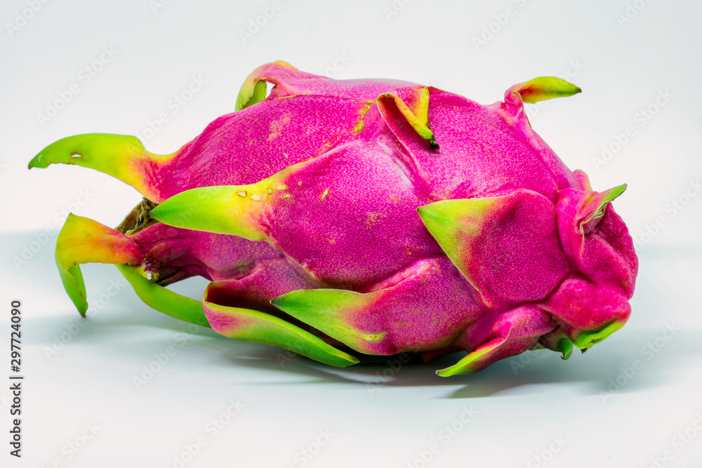 A ripe dragon fruit isolated on a white background