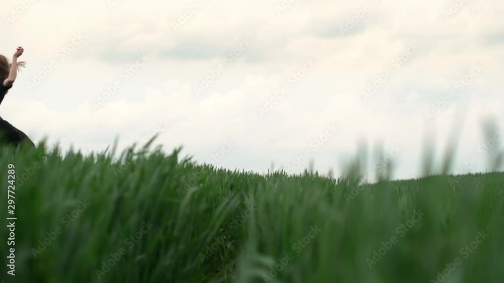 Girl In Black Dress Runs The Field. Romantic Image Of Blonde. Girl In Black Dress Runs The Field. Romantic Image Of Blonde.