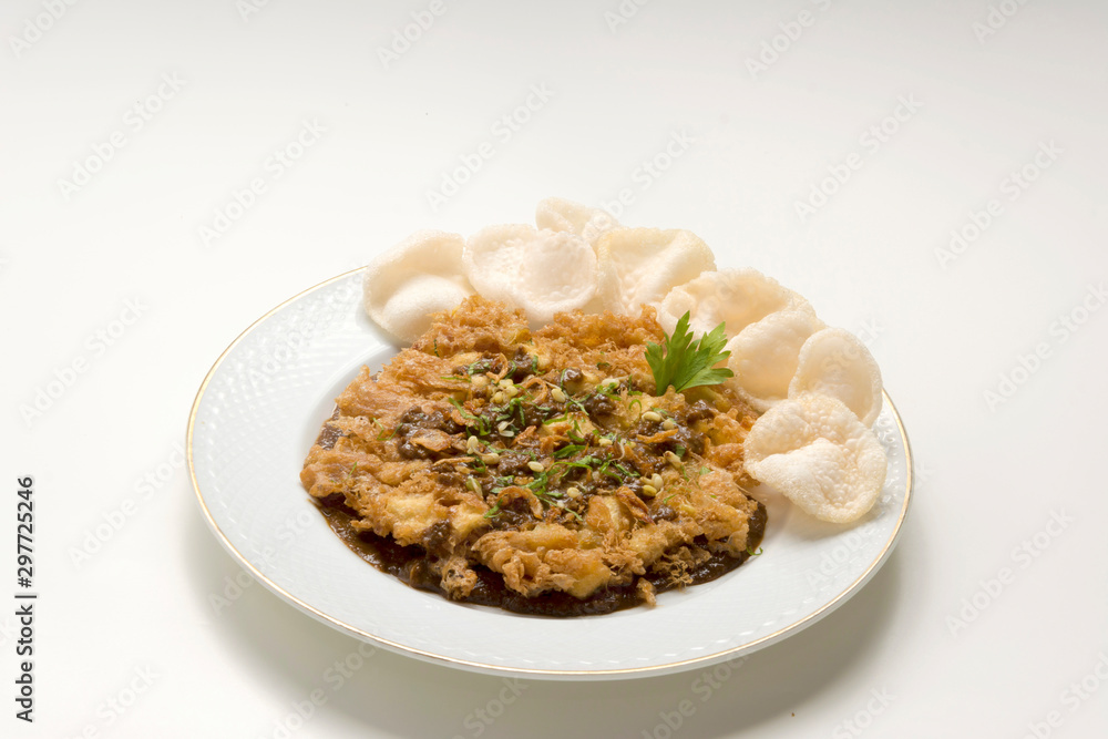 Tahu Telur/Fried Egg Tofu Javanese bean curd omelette with bean sprouts, peanuts and savory soy sauce. Tahu Telur/Fried Egg Tofu Javanese bean curd omelette with bean sprouts, peanuts and savory soy sauce.