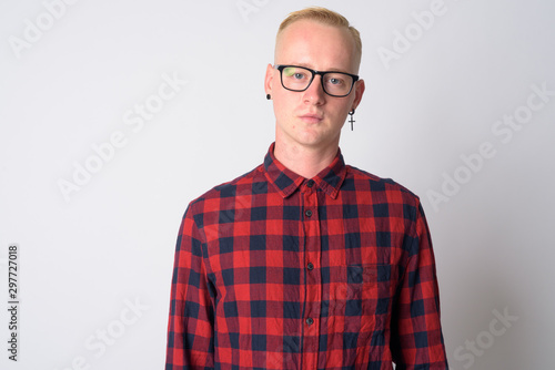 Face of young blonde hipster man with eyeglasses and earrings © Ranta Images