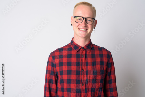Face of happy young blonde hipster man smiling at camera © Ranta Images