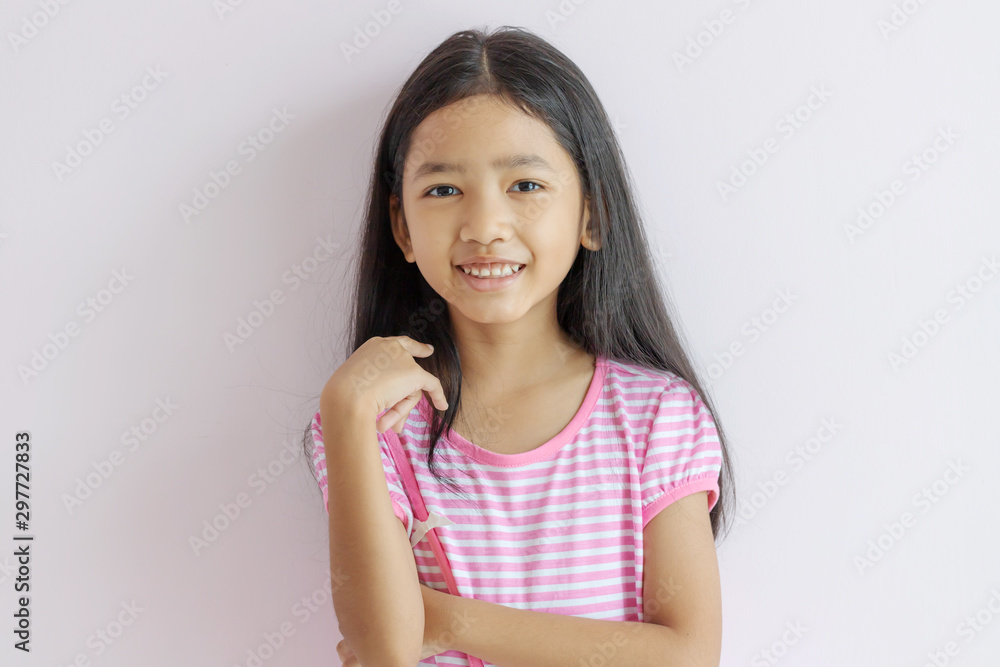 Children wearing pink cross white dresses and long black hair Children wearing pink cross white dresses and long black hair