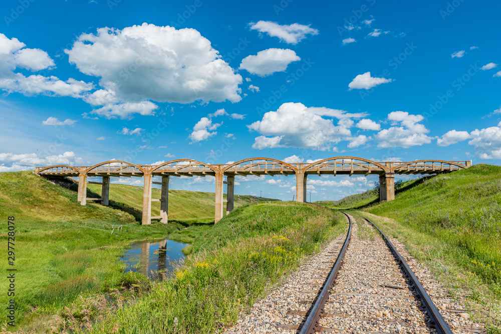 The old concrete bridge in Scotsguard, SK with railway tracks underneath