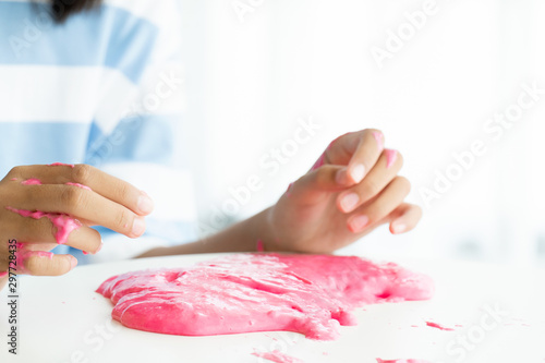 Hand Holding Homemade Toy Called Slime, Kids having fun and being creative by science experiment