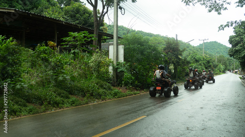 A tour group travels on ATVs on the road and mountains in Maetaman Elephant Camp & Bamboo Rafting  chiangmai Thailand photo