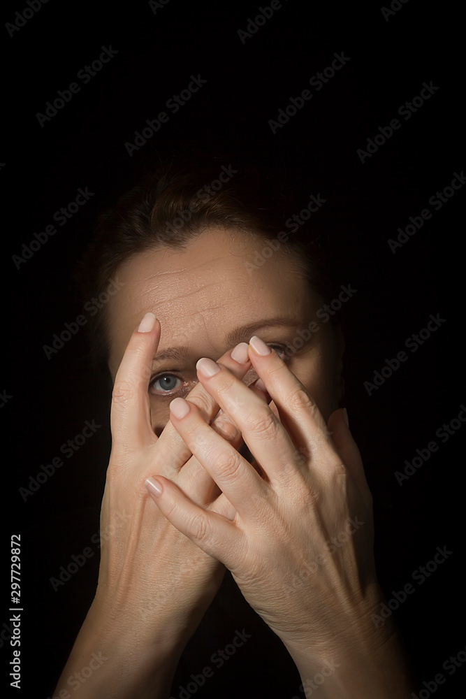Woman covers her face with hands. Woman covers her face with hands.