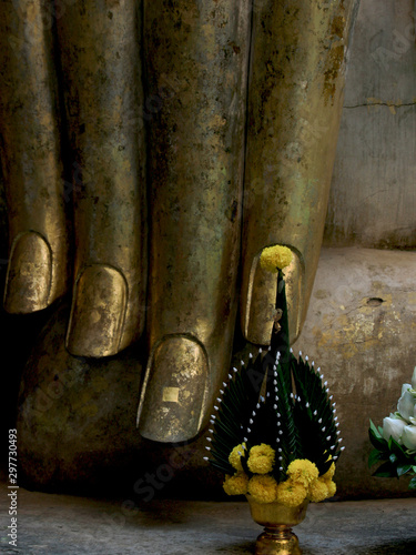 Fingers of Buddha statue at wat Si Chum temple, one of  popular tourist attractions and famous landmarks in Sukhothai historical park, Sukhothai province, Thailand. UNESCO world heritage city. photo