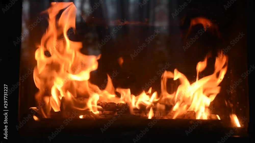 Burning fireplace with dancing glowing fire in a country house. Cozy Home Concept, Christmas and new year holidays, vacation, winter or autumn season. Burning fireplace with dancing glowing fire in a country house. Cozy Home Concept, Christmas and new year holidays, vacation, winter or autumn season.