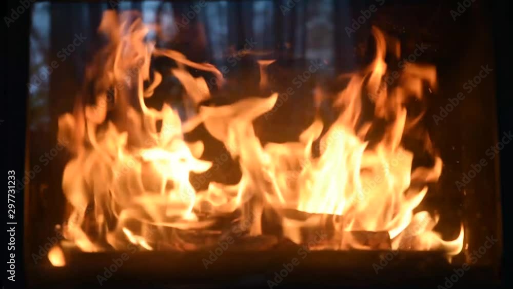 Burning fireplace with dancing glowing fire in a country house. Cozy Home Concept, Christmas and new year holidays, vacation, winter or autumn season. Burning fireplace with dancing glowing fire in a country house. Cozy Home Concept, Christmas and new year holidays, vacation, winter or autumn season.