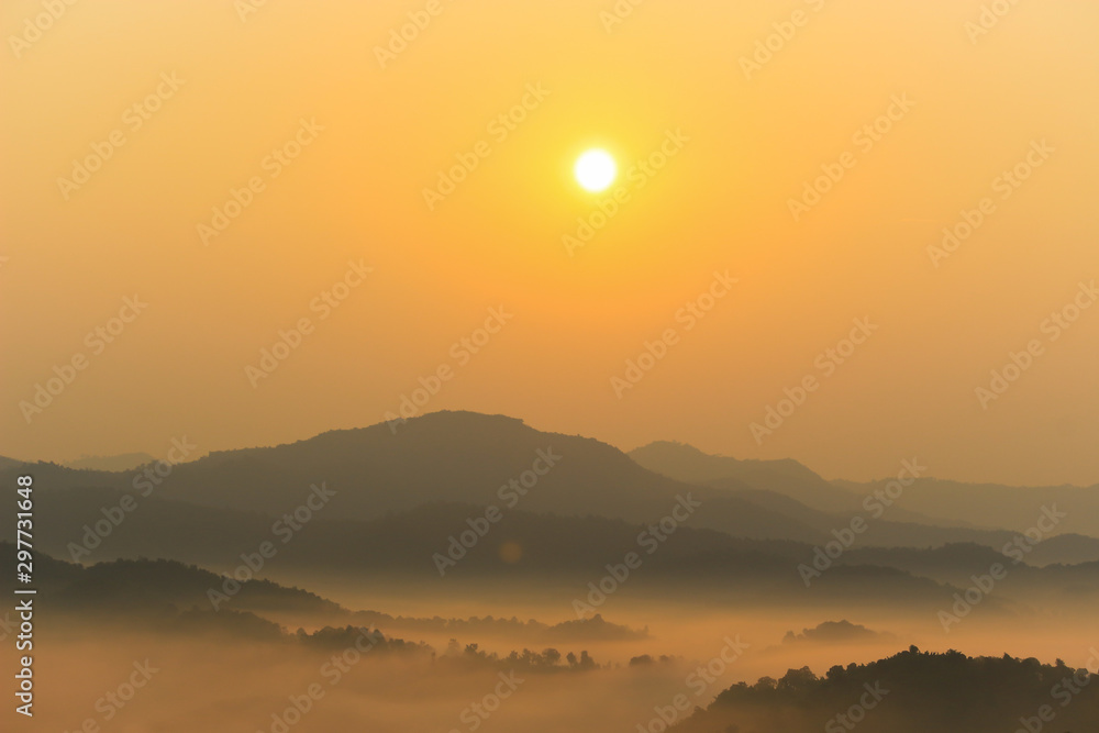 Beautiful scenery of mountain with  mist sea and sunrise sky at view point of Na Ton Chan in the early morning, Si Satchanalai, Sukhothai Province , Thailand.