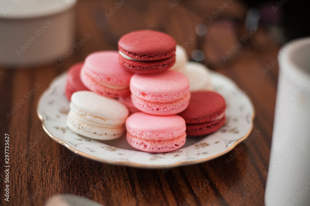 Fototapeta premium macaroons on a table with coffee in home