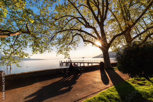 Natural Landscape Scenery View of Lake Geneva and Swiss Alps at Switzerland, Nature Scenic Horizontal Waterfront of Lake at Sunset. Panoramic Lakeside of Geneva in Spring Season at Vevey, Switzerland.