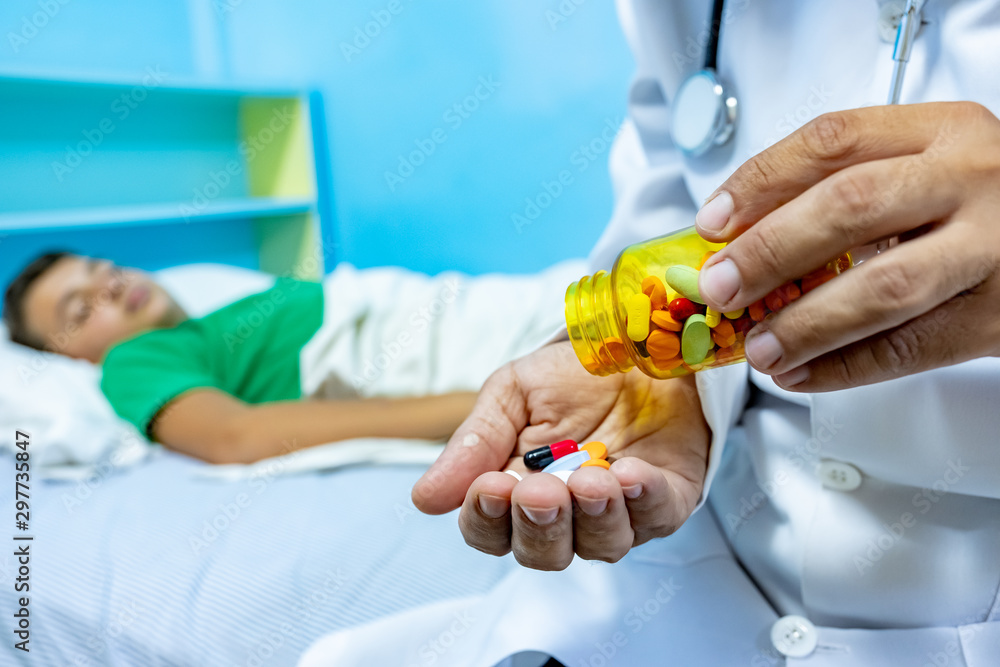 Doctor giving his patient some medicine Doctor giving his patient some medicine