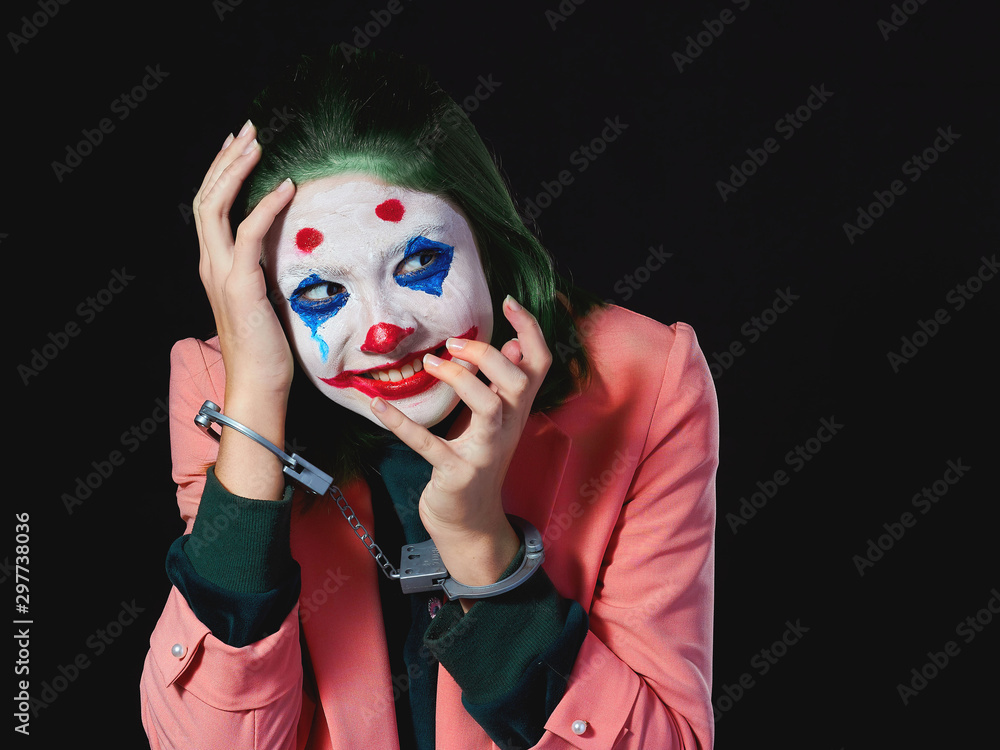 Makeup for halloween woman in Joker costume on black background shooting in  Studio. foto de Stock | Adobe Stock