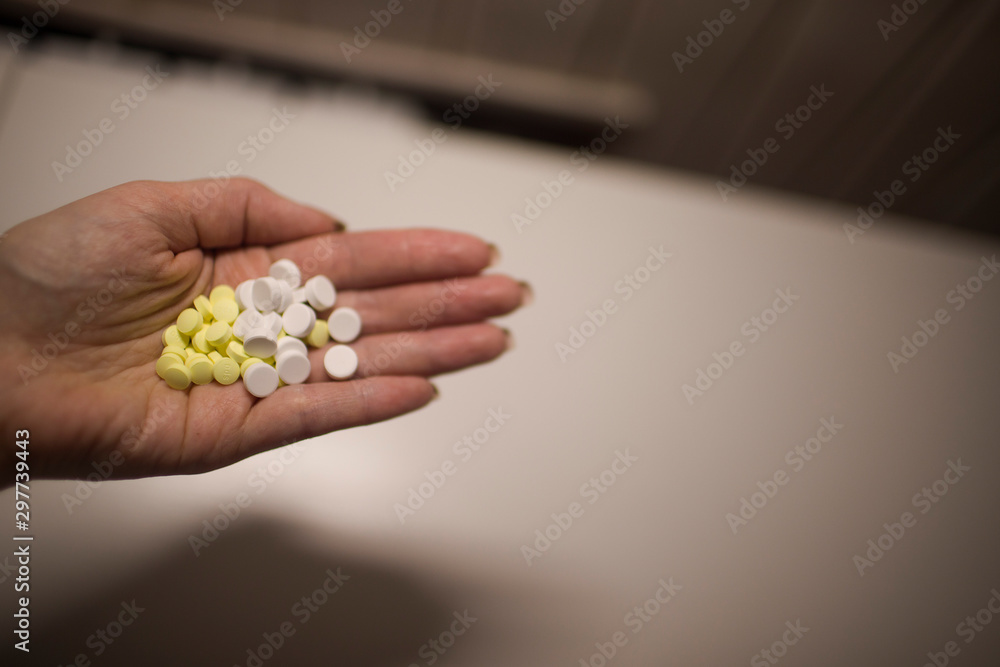 Colorful pills on hand Colorful pills on hand
