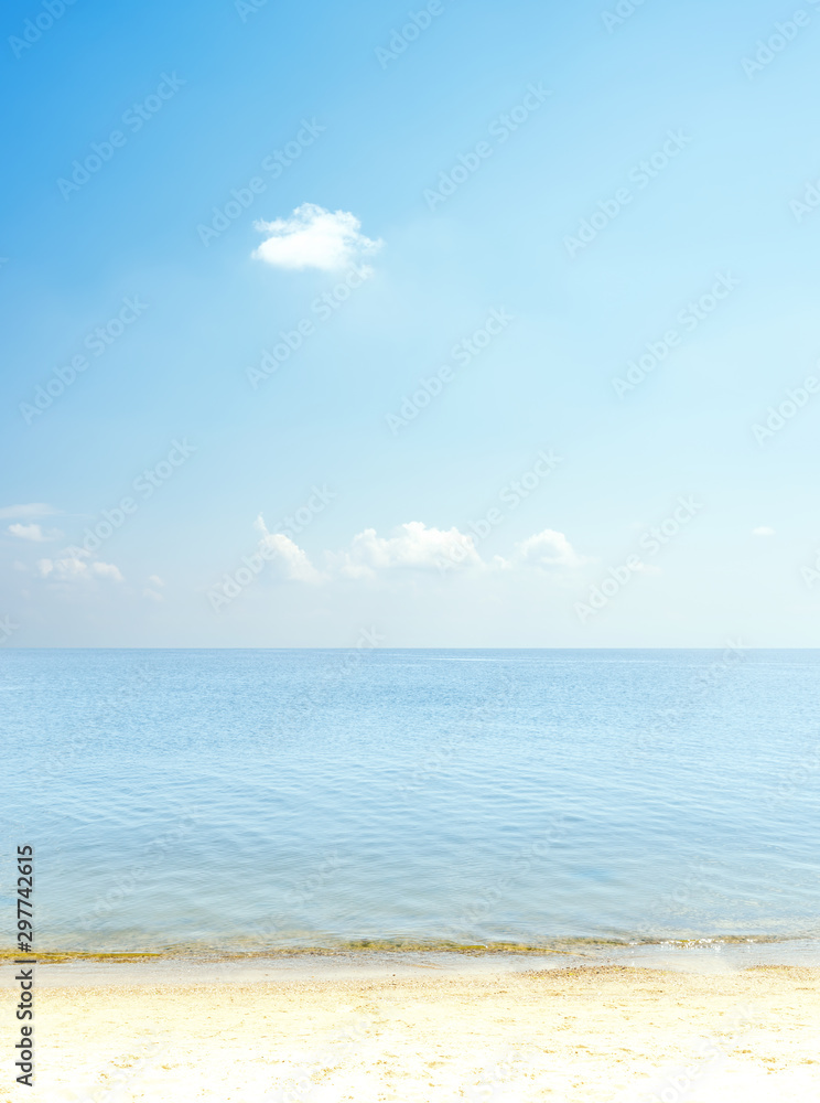 blue sky with clouds over sea and sand