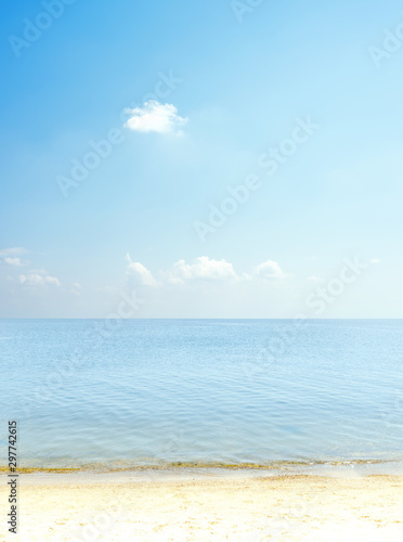 blue sky with clouds over sea and sand