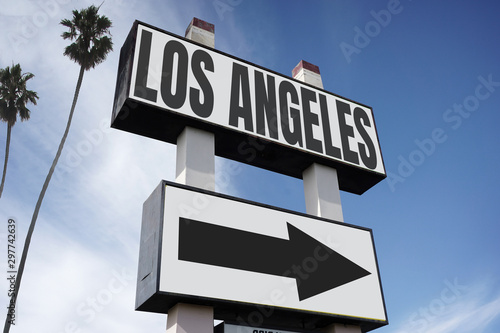 aged and worn Los Angeles sign with palm trees