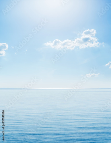 sunshine in blue sky with clouds over sea
