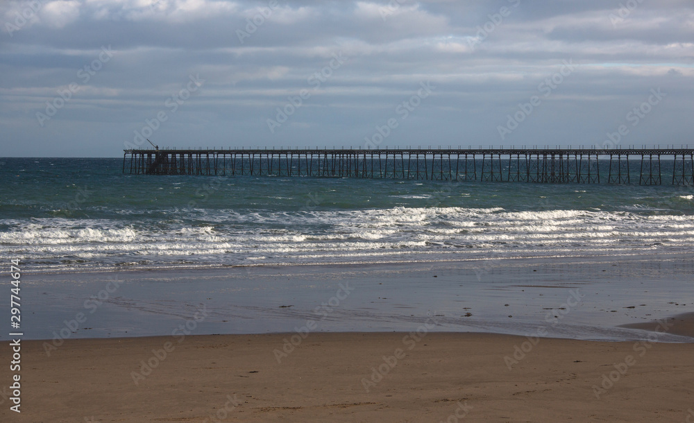 Ramsey Beach, Isle of Man, British Isles, with abandon pier in the background
