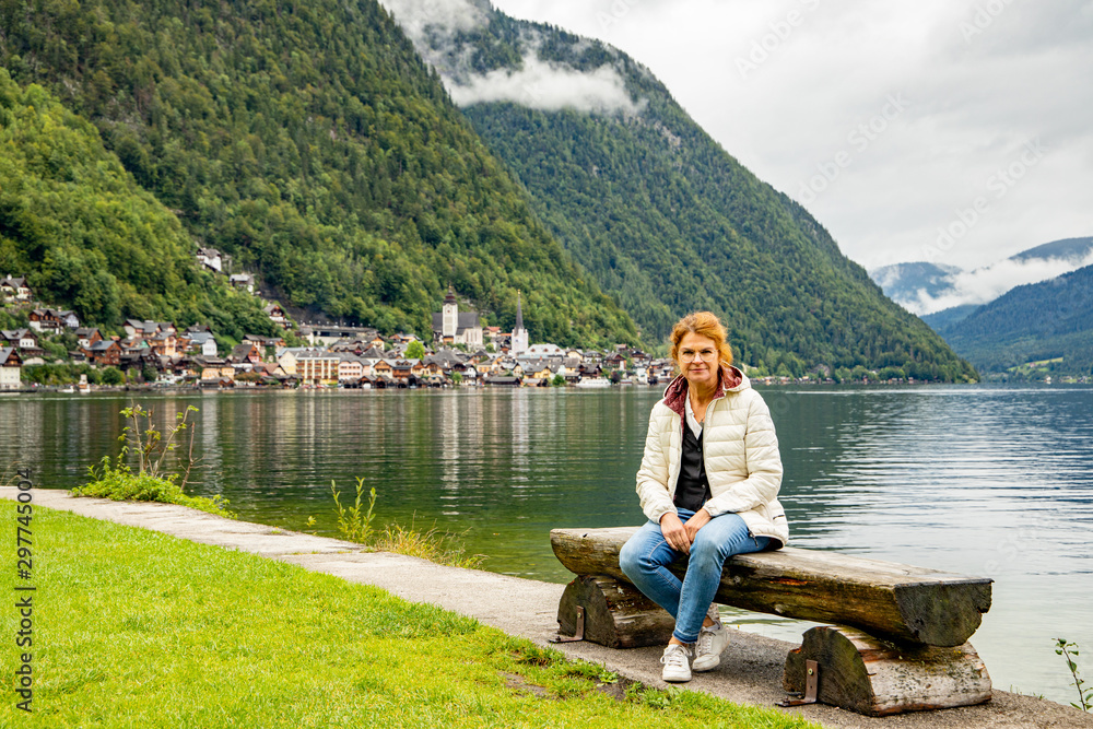 Woman in Hallstatt at the Hallstätter lake in Austria Woman in Hallstatt at the Hallstätter lake in Austria