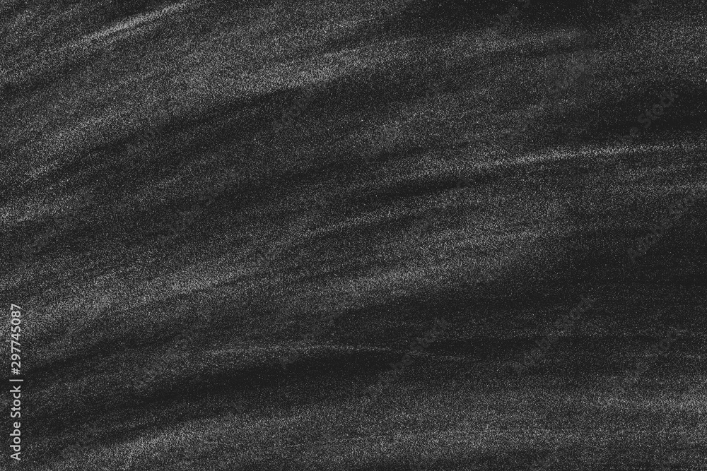 Fototapeta premium Dirty chalkboard background. Whte chalk stains on blackboard after removing lettering.