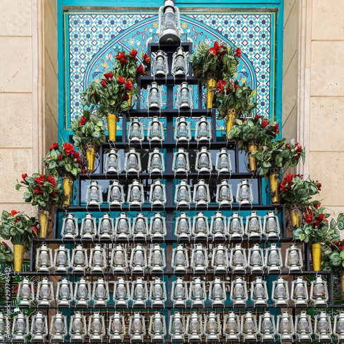 Фотография kerosene lamps in front of a mosque, as a symbol of mourning of Imam Husayn mart