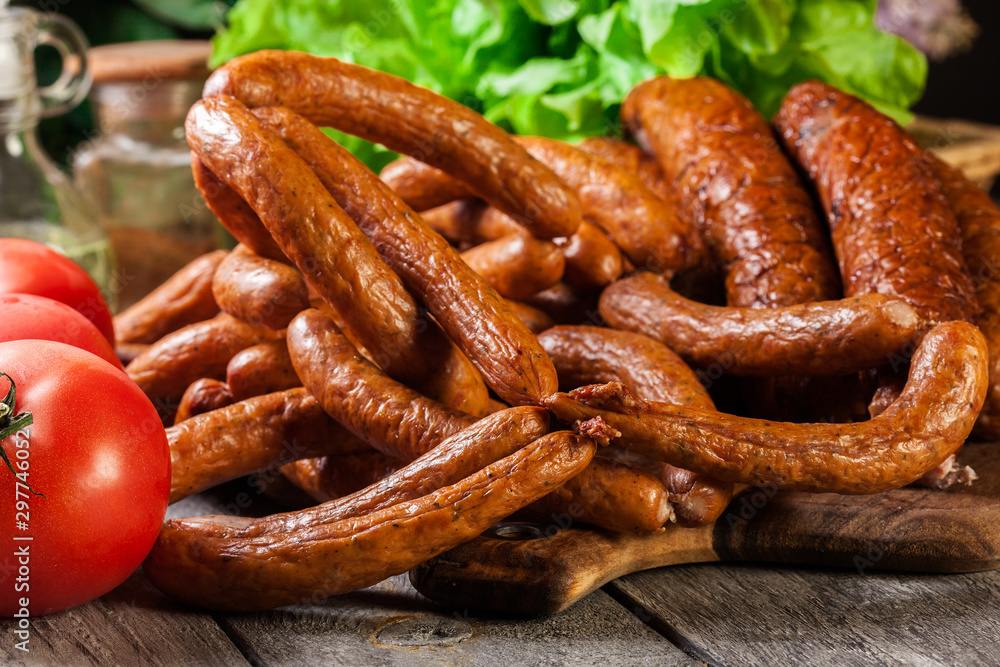 Assorted smoked sausages on a cutting board Assorted smoked sausages on a cutting board